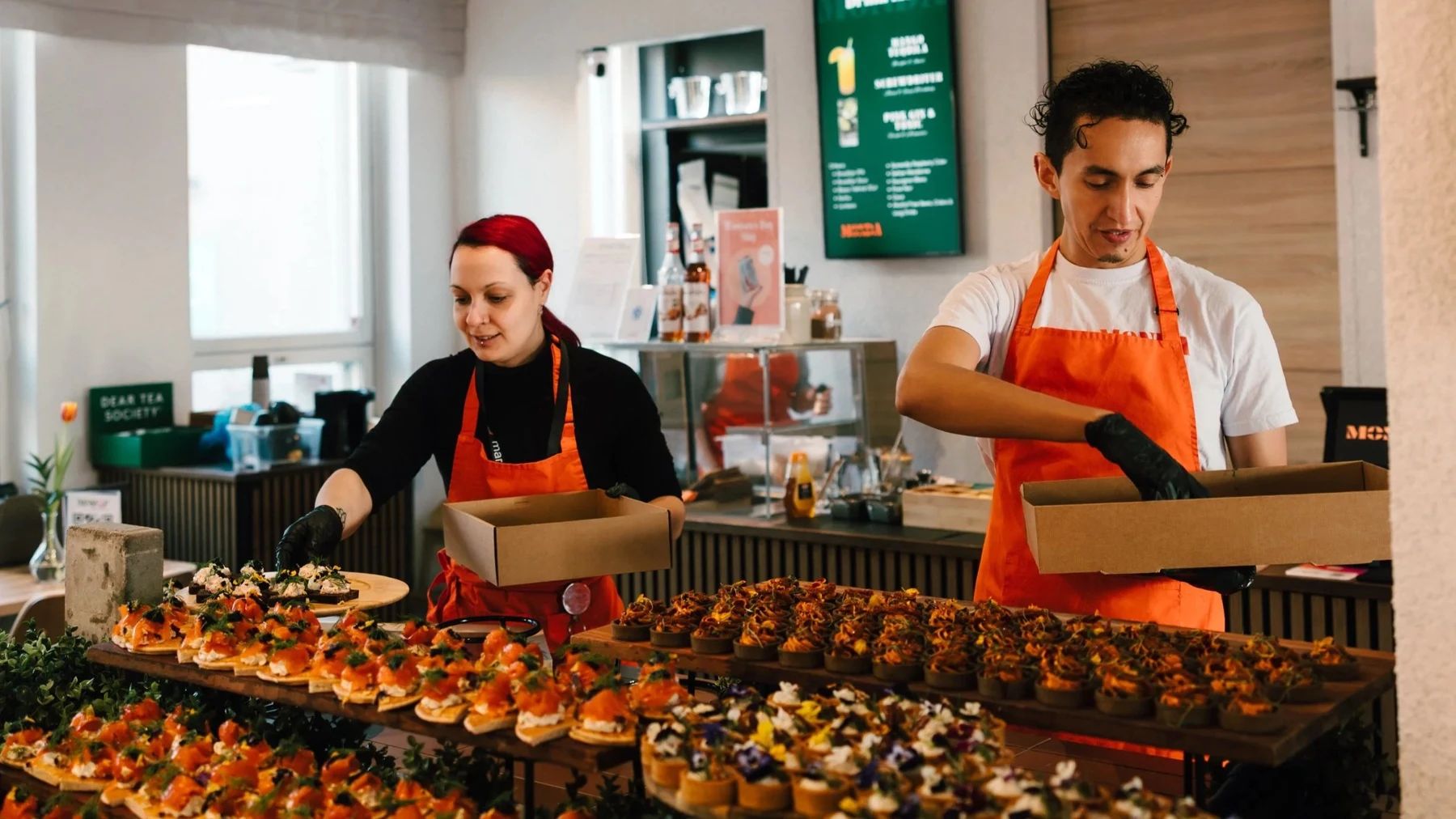 Monda’s team preparing a generous catering spread